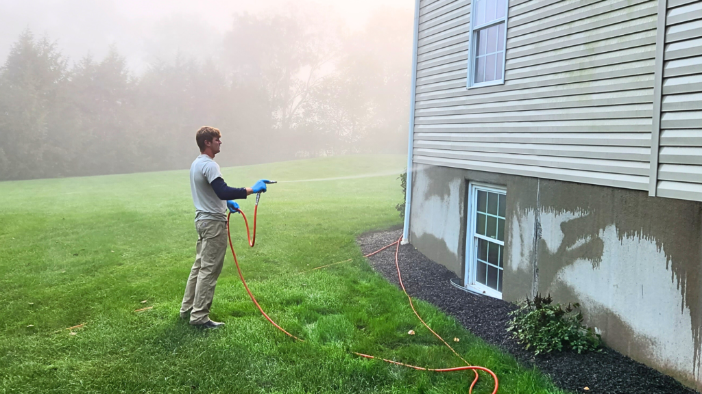 martins pest control spraying for termites at a home in virginia